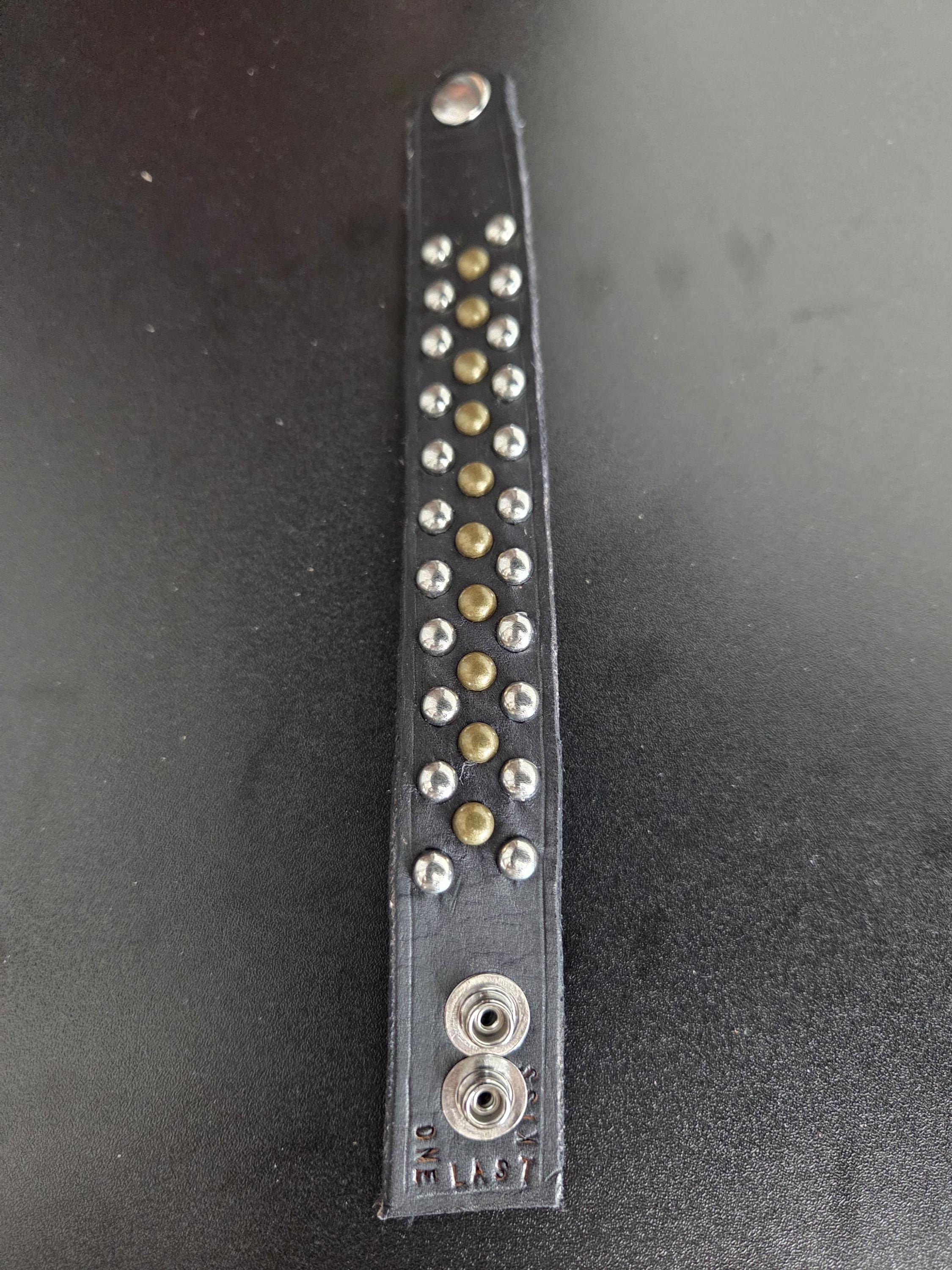 Studded leather punk wrist cuff.