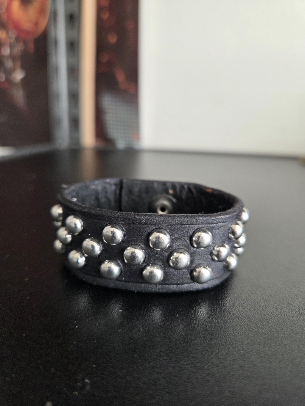 Studded leather punk wrist cuff.