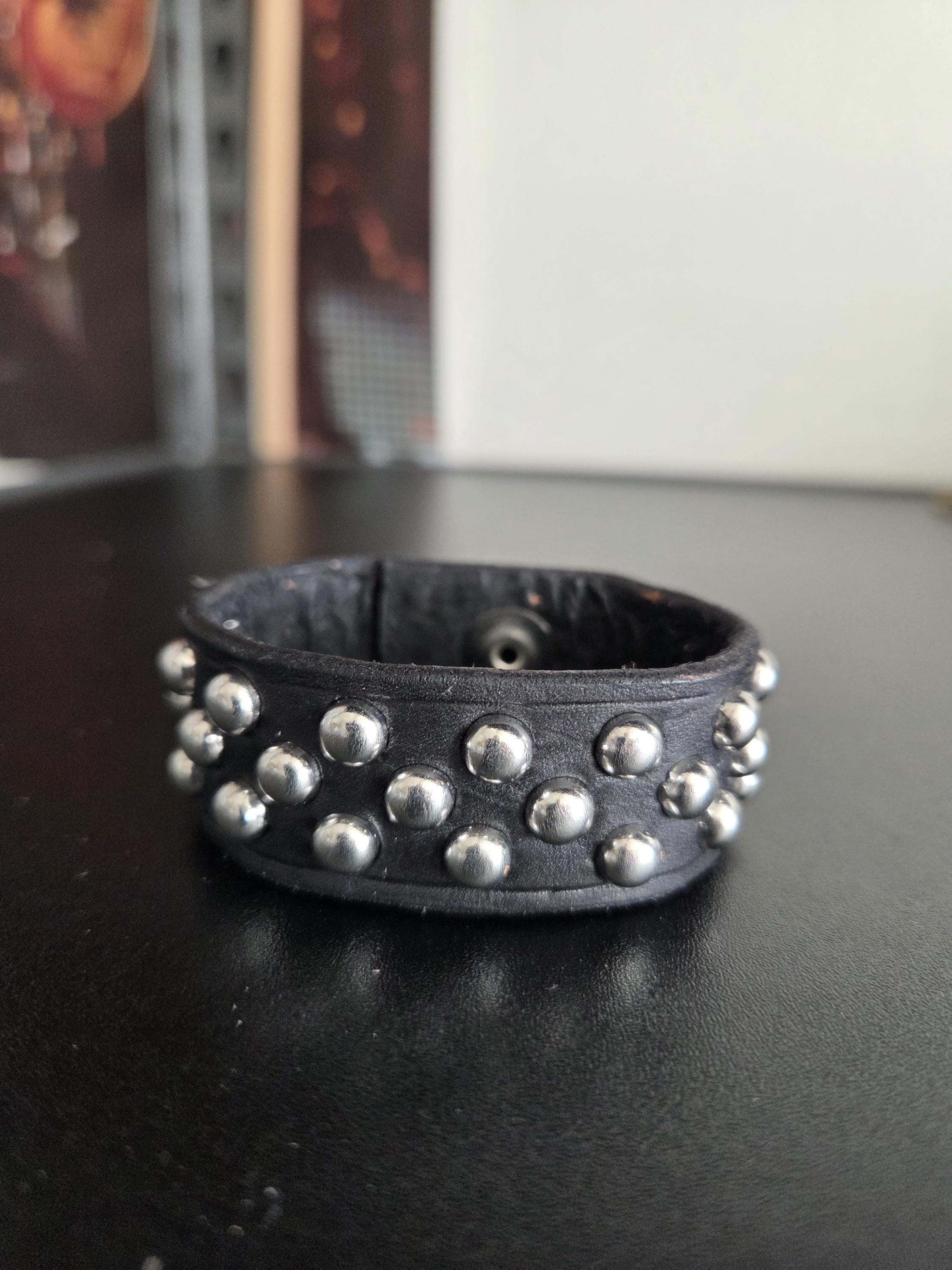 Studded leather punk wrist cuff.