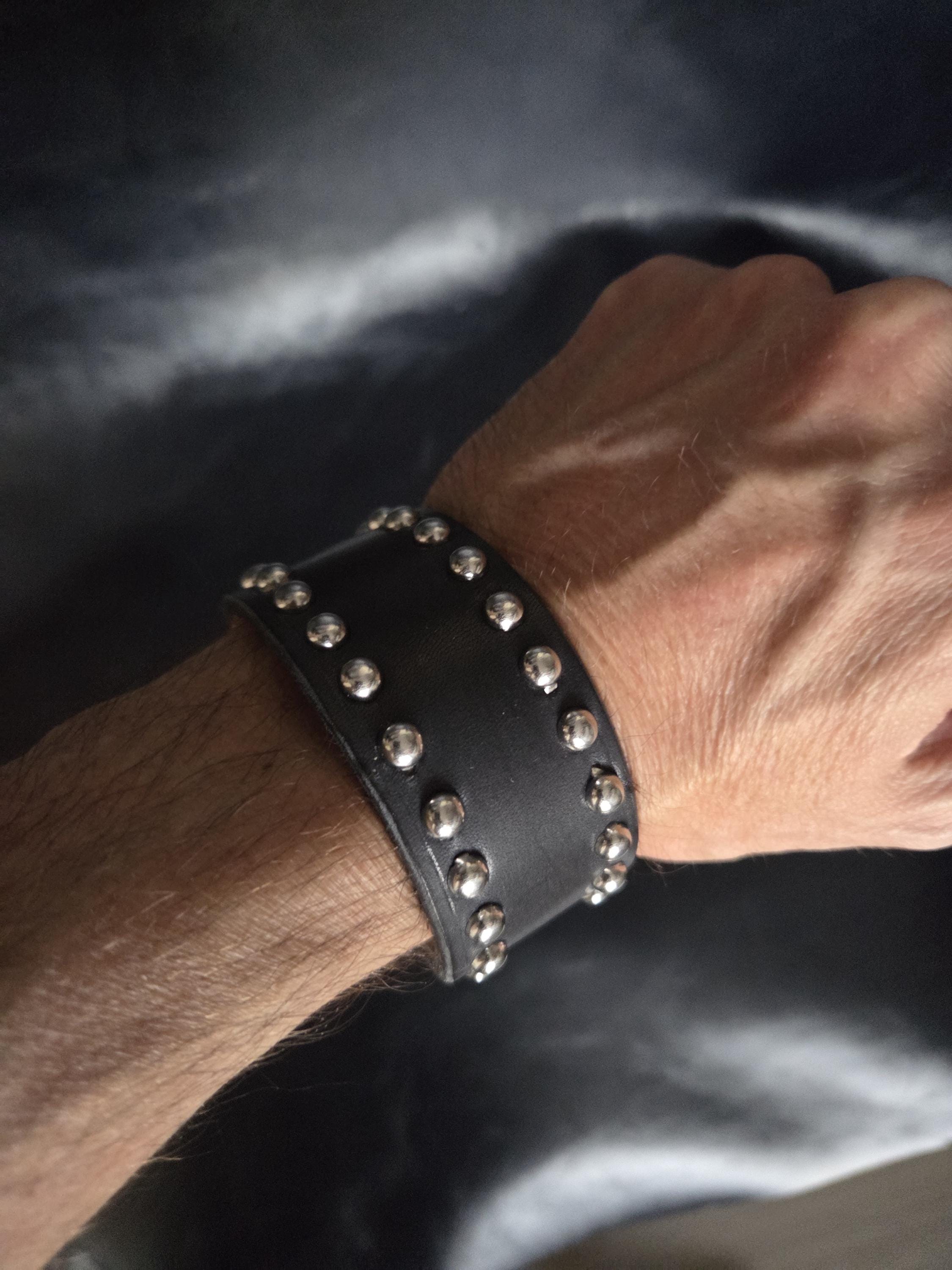 Studded leather wrist cuff.