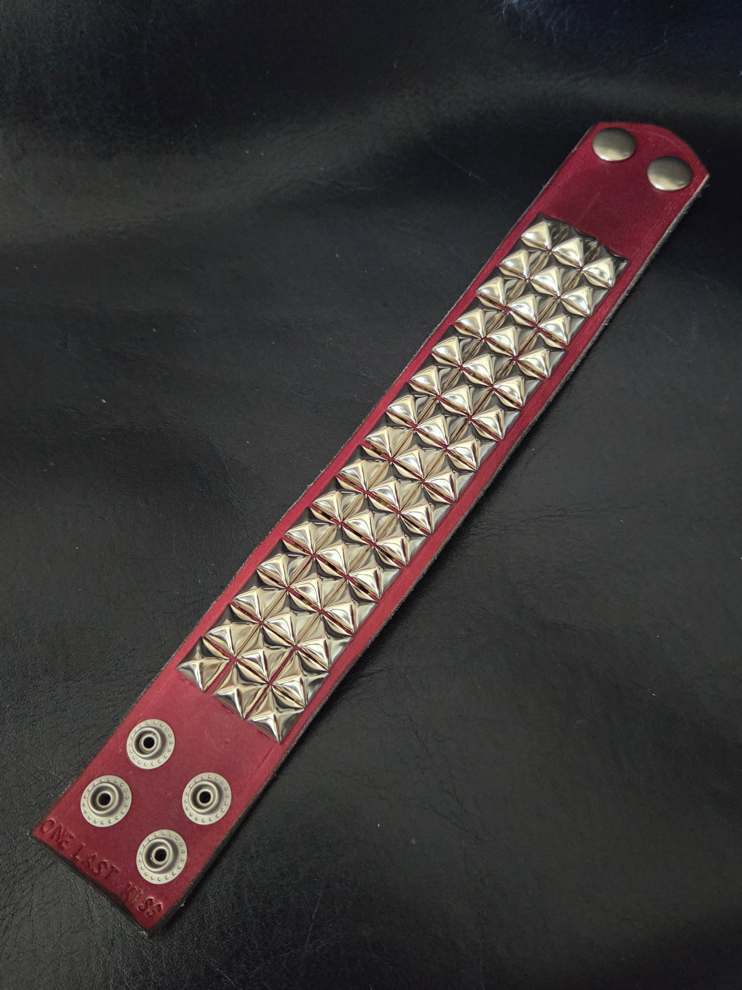 The "Defender" cuff. Available in red or blue.