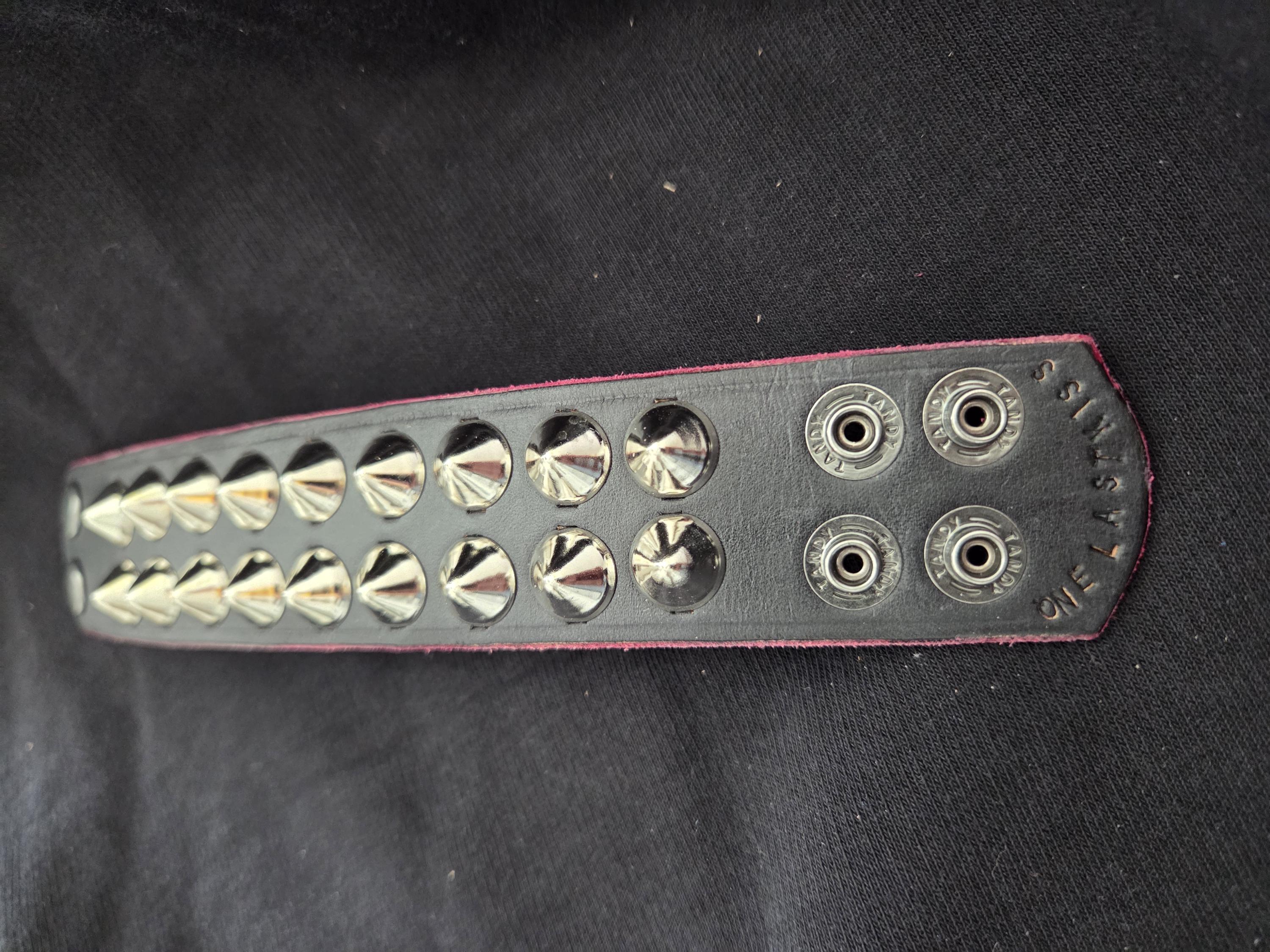 Studded leather punk wrist cuff.