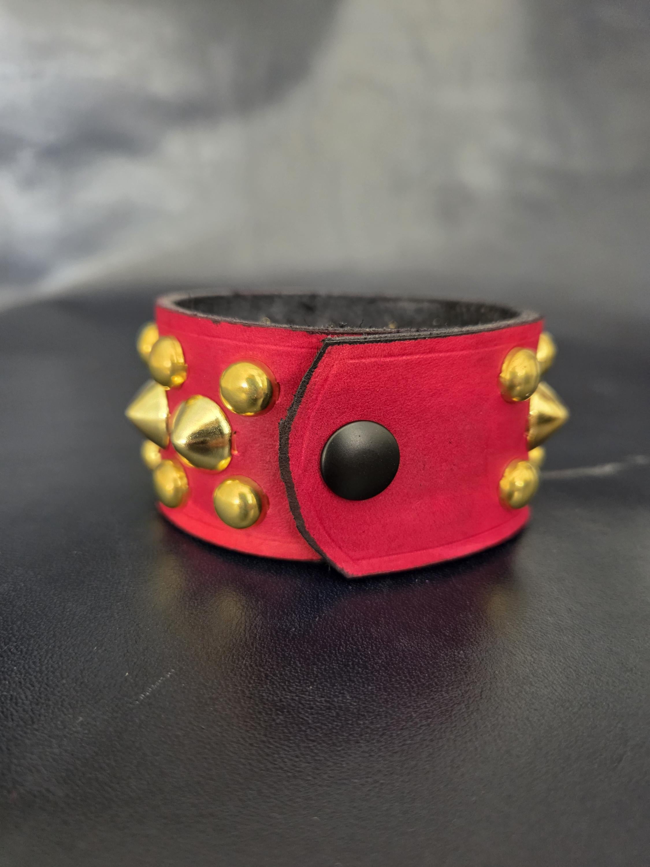 Red Punk studded wrist cuff.