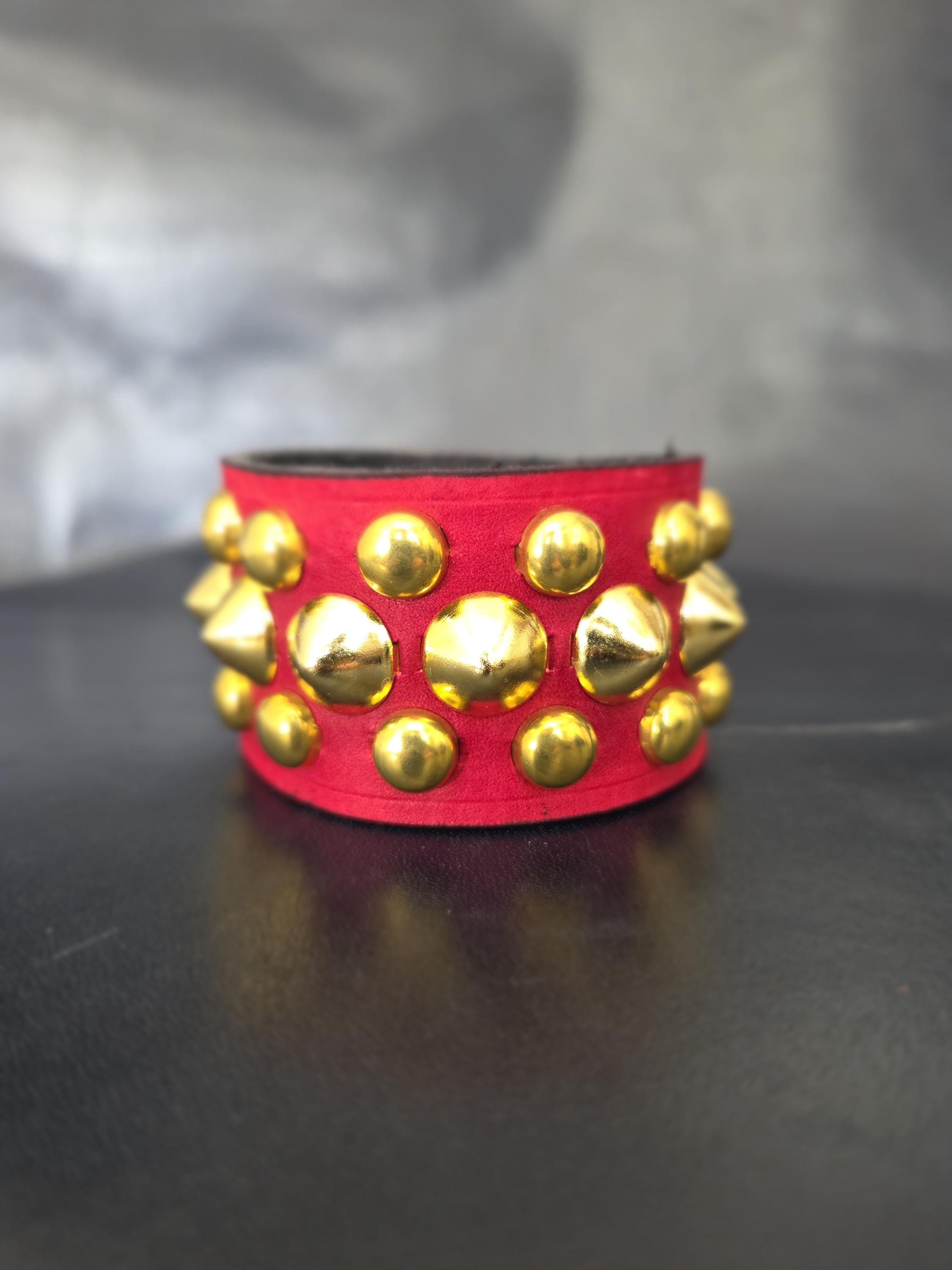 Red Punk studded wrist cuff.