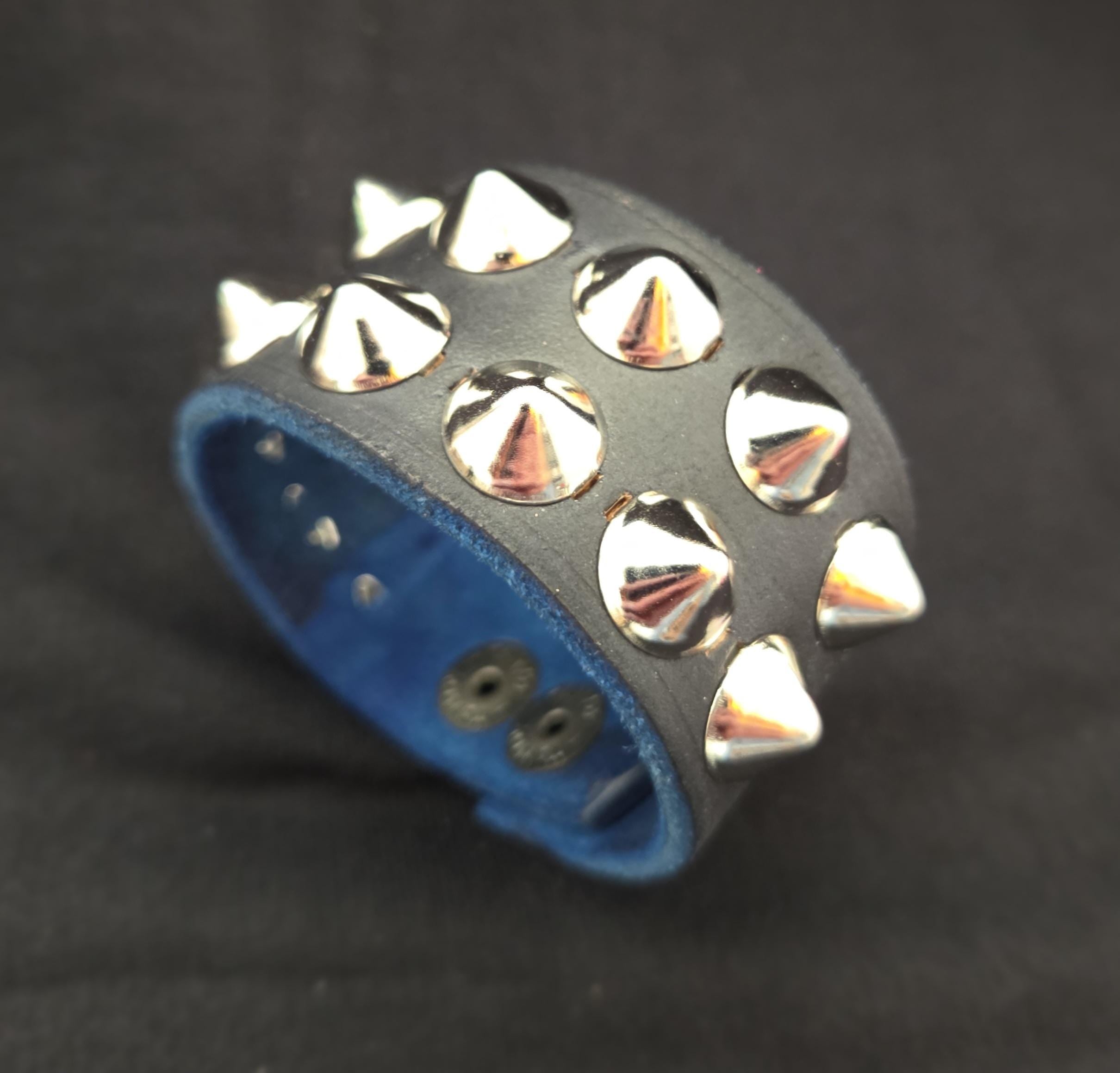Studded leather punk wrist cuff.