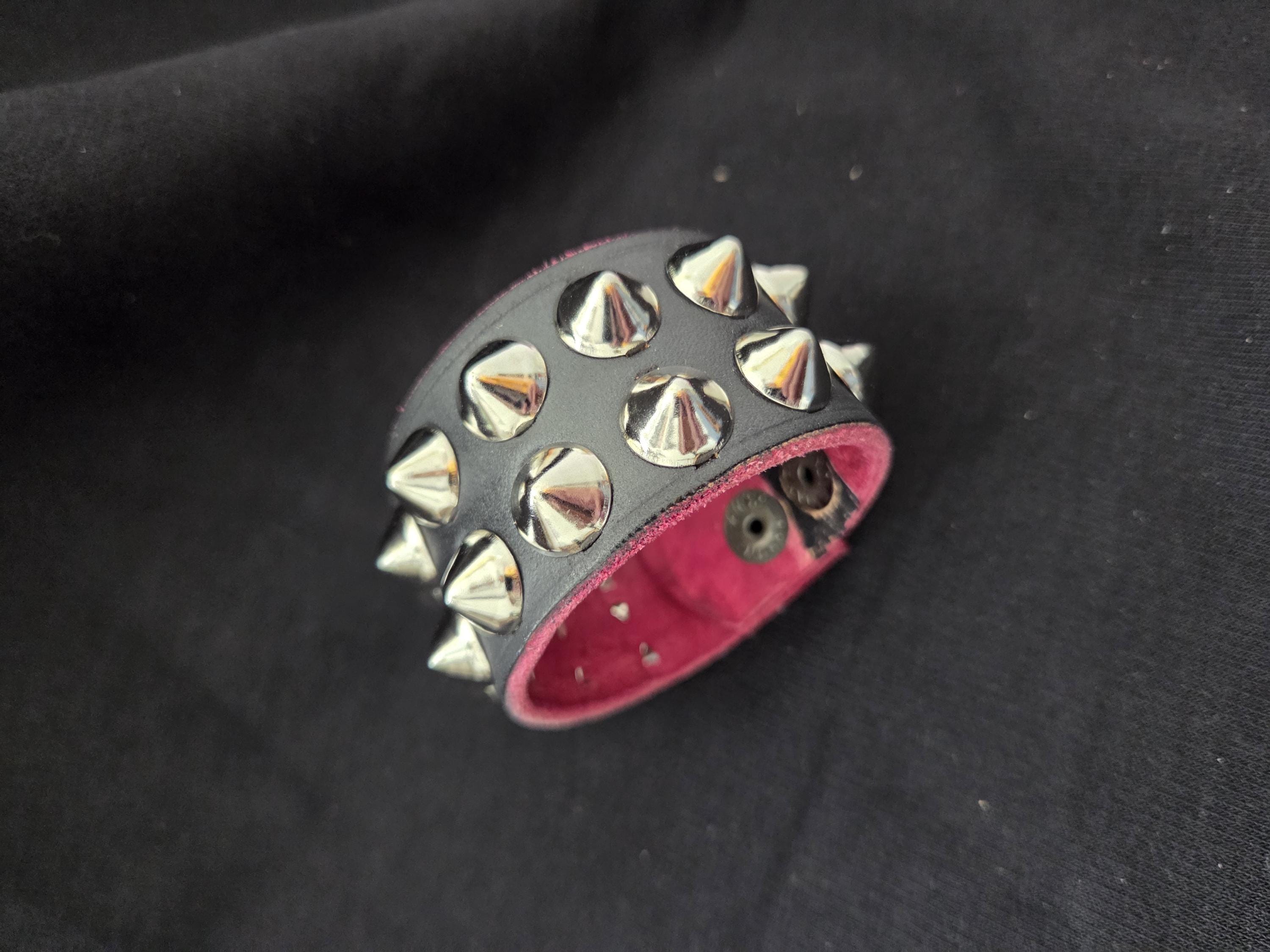 Studded leather punk wrist cuff.