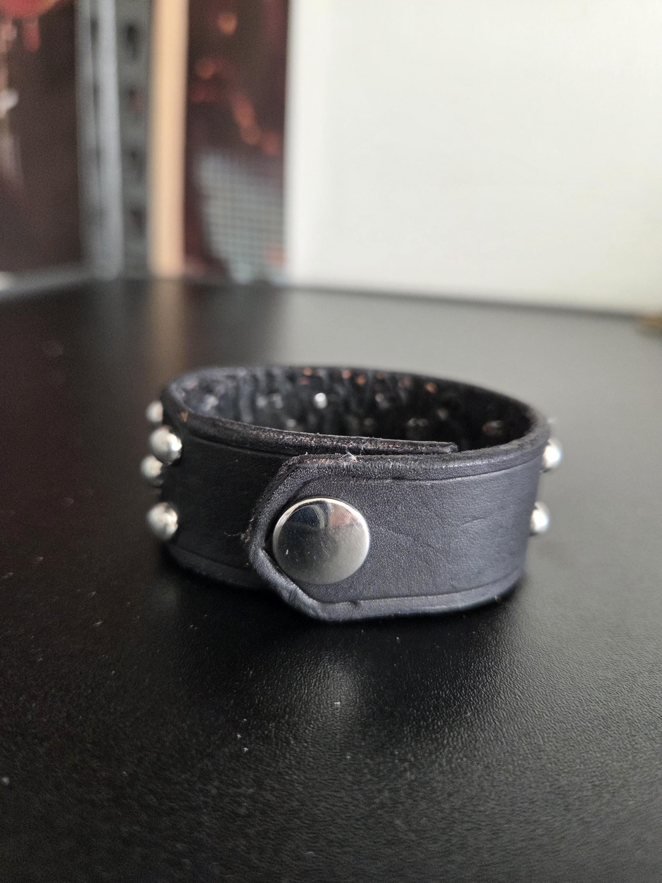 Studded leather punk wrist cuff.
