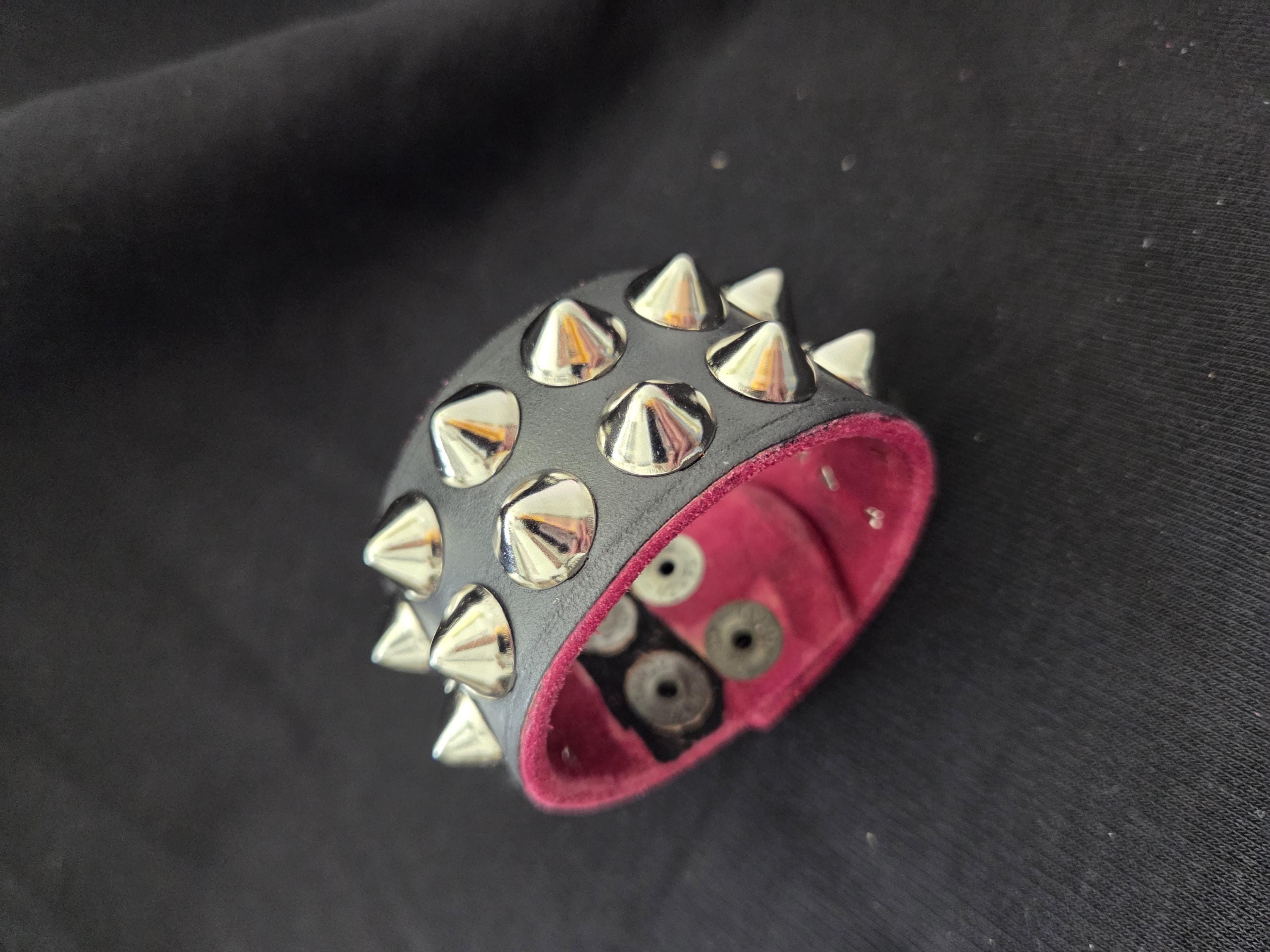 Studded leather punk wrist cuff.