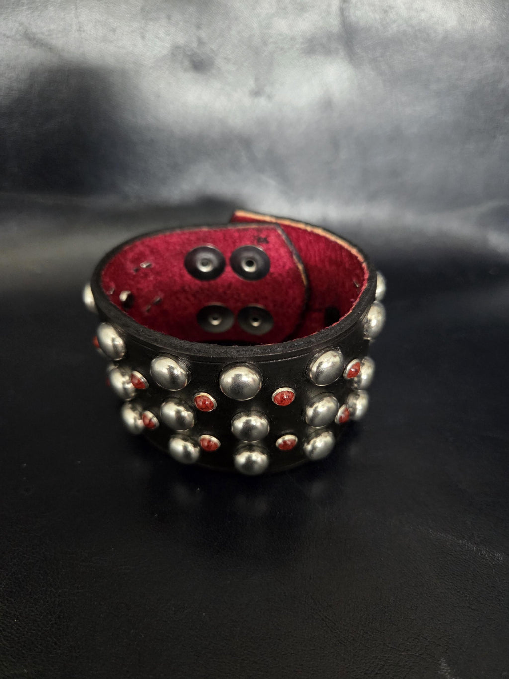 Studded wrist cuff.