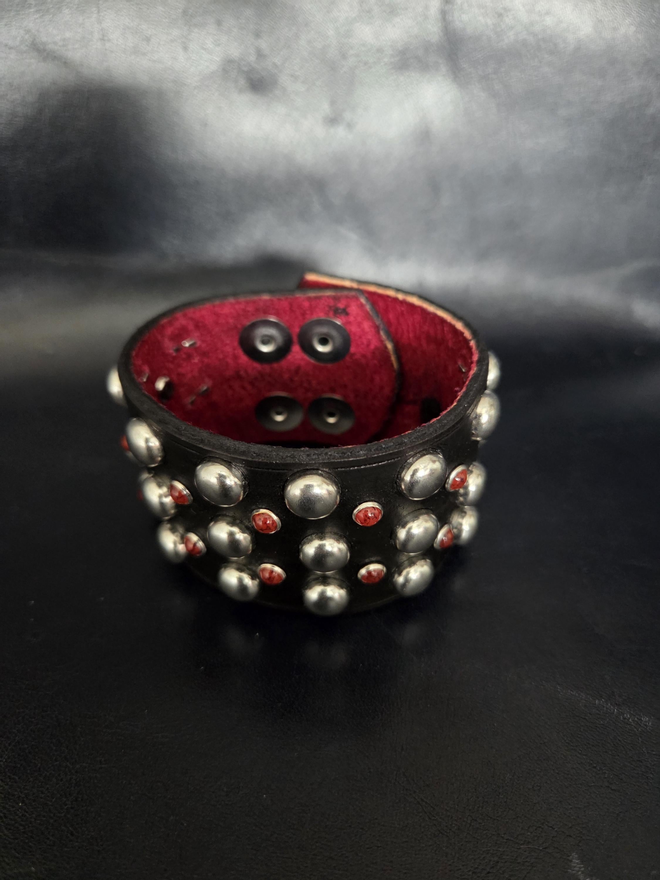 Studded wrist cuff.