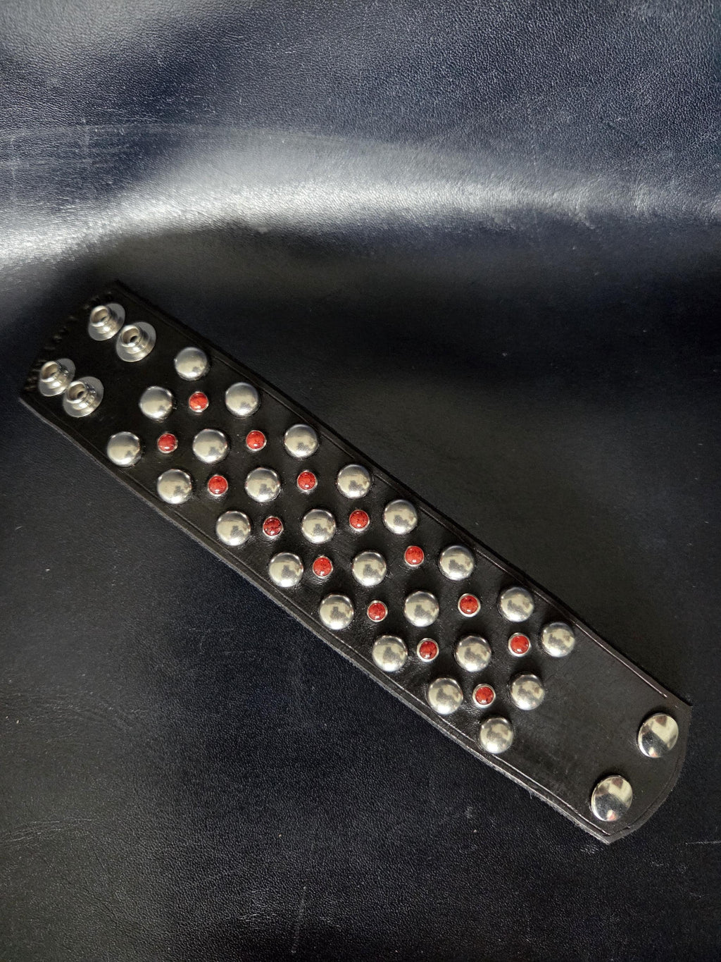 Studded wrist cuff.