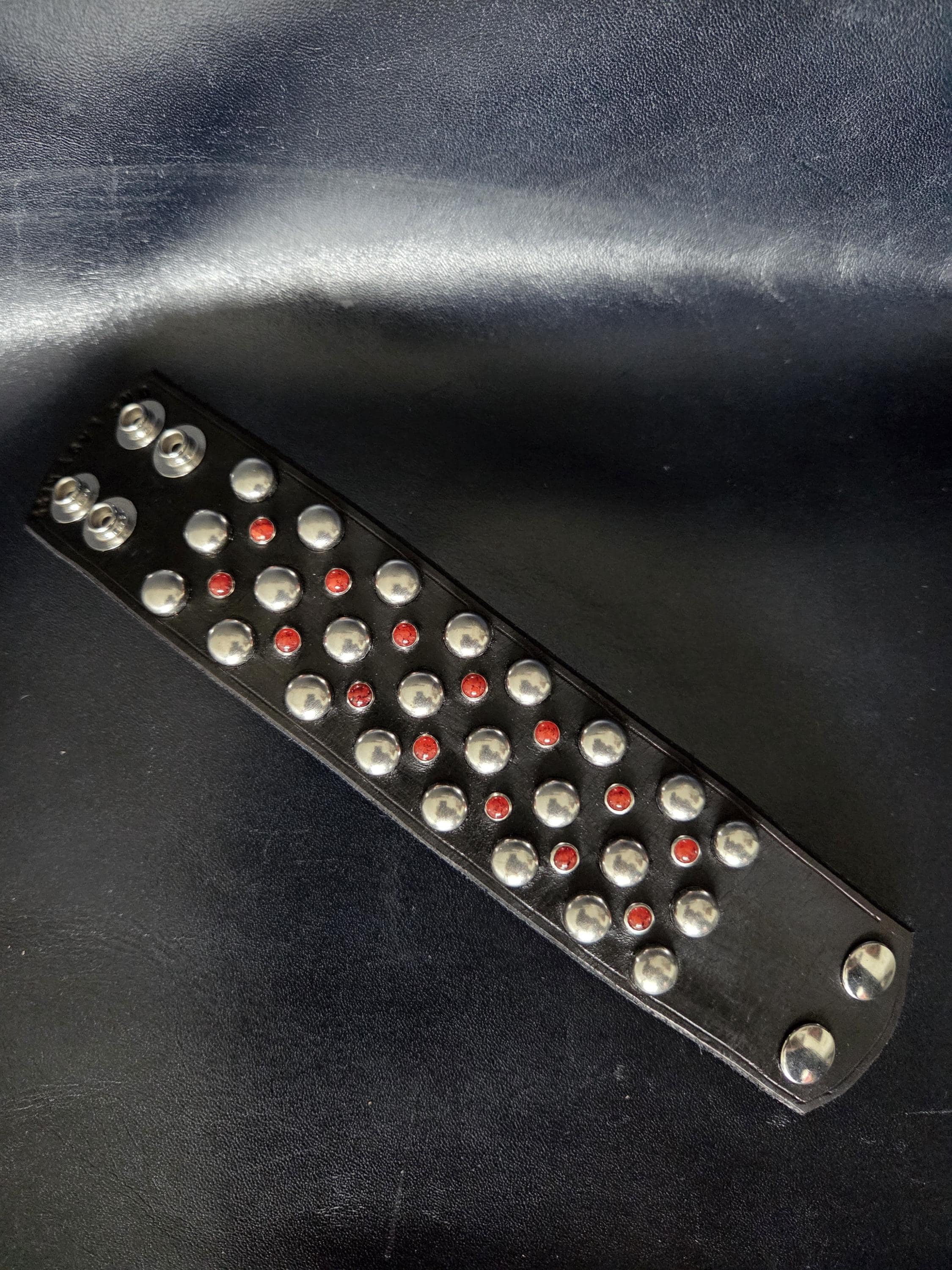 Studded wrist cuff.