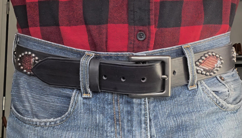 Handmade distressed leather belt with snakeskin print inlays.