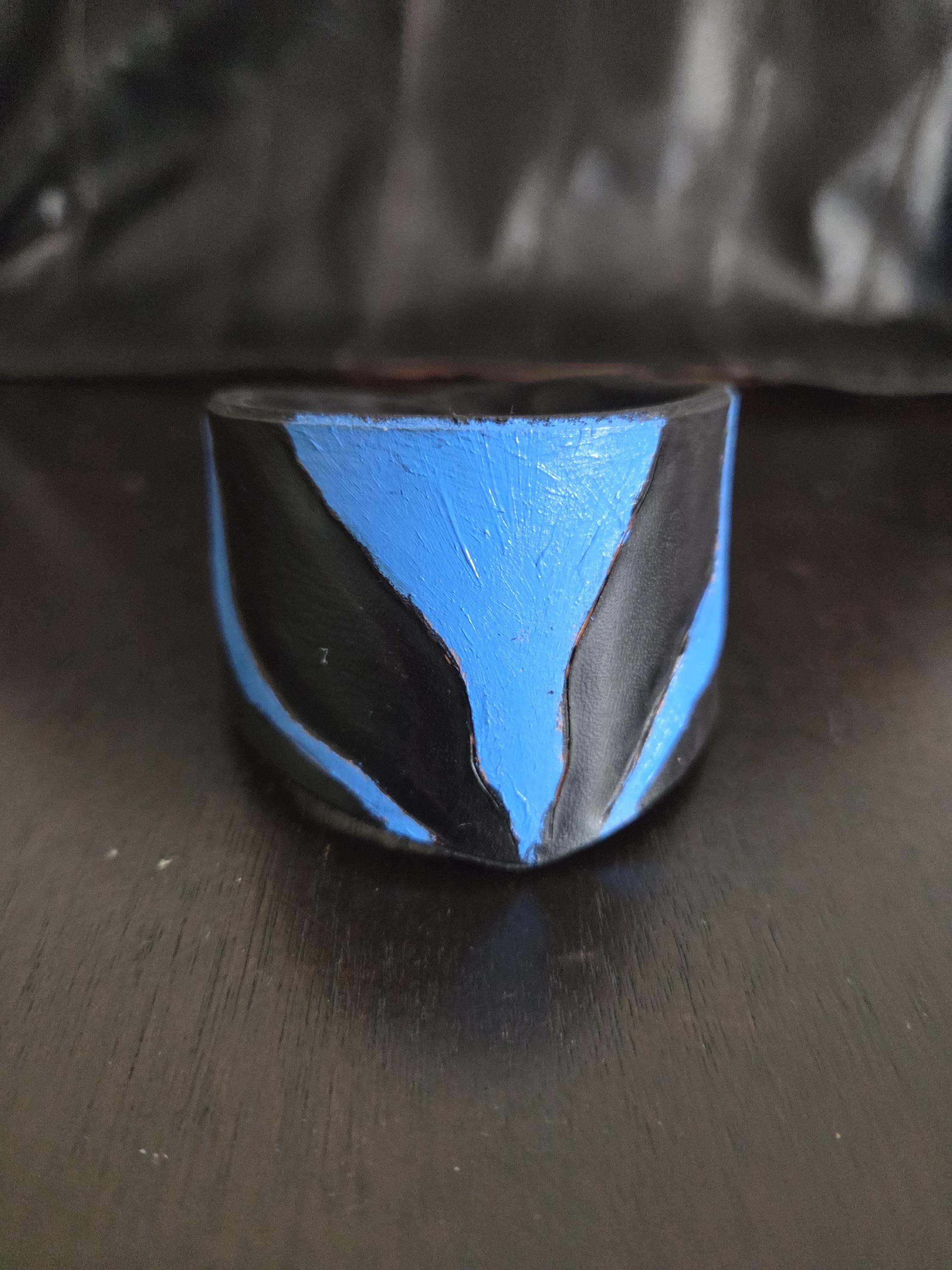 Black n' blue leathet wrist cuff bracelet.