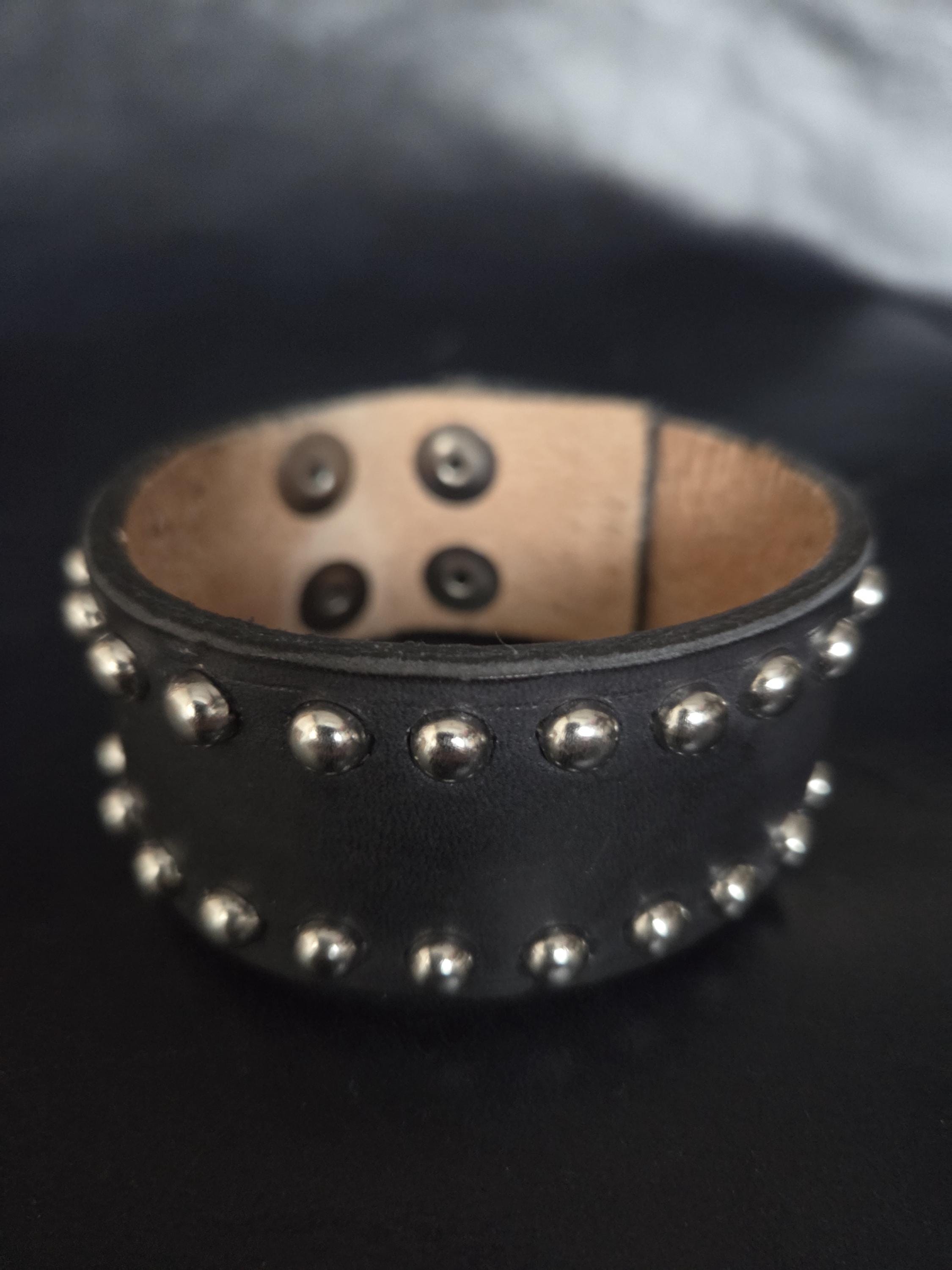 Studded leather wrist cuff.