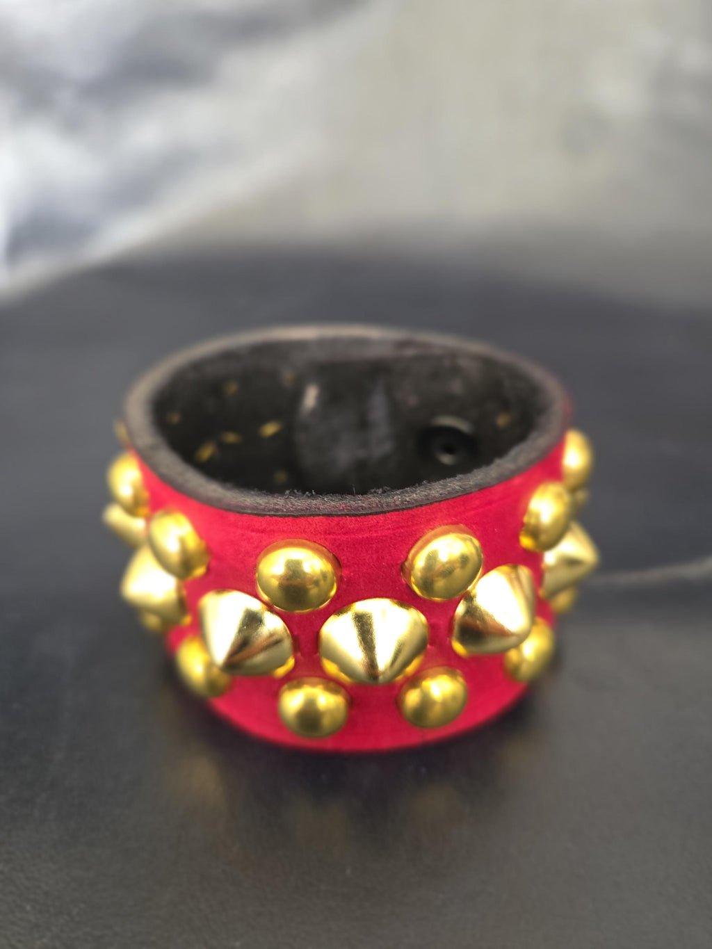 Red Punk studded wrist cuff.