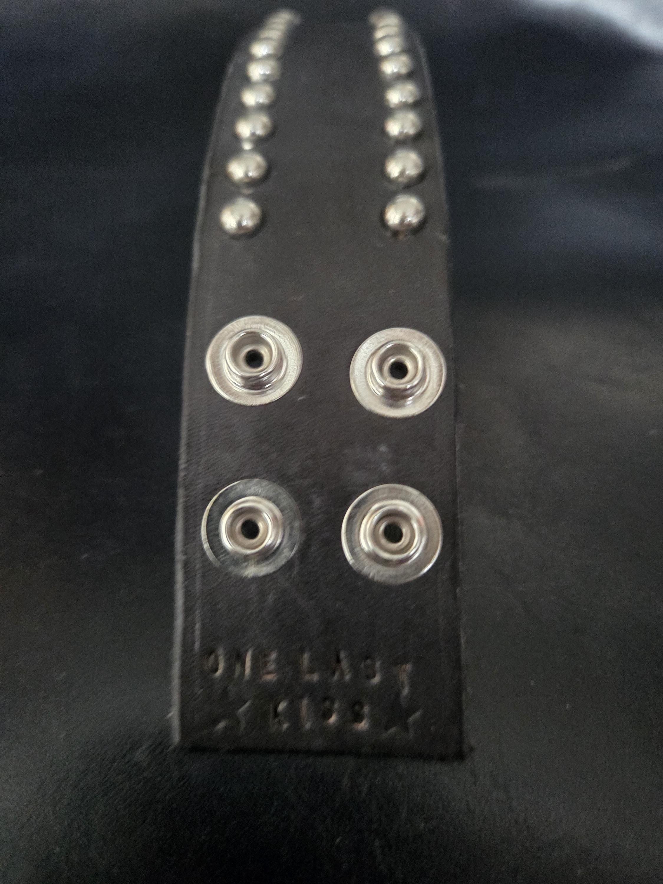 Studded leather wrist cuff.