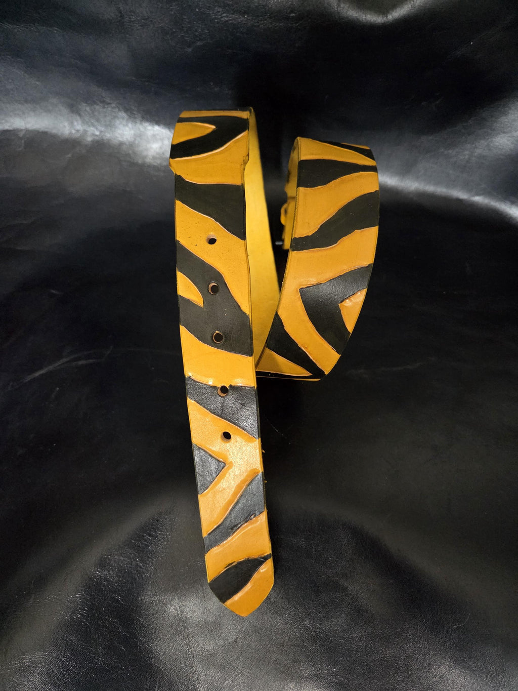 Leather tiger-stripe belt.