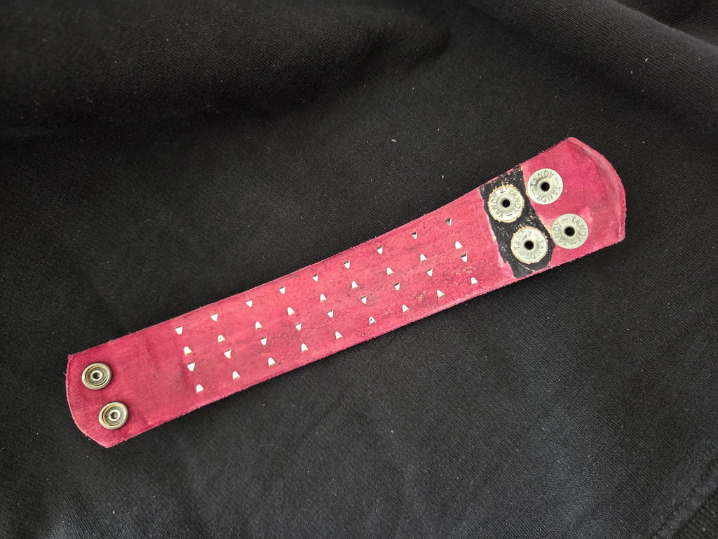 Studded leather punk wrist cuff.