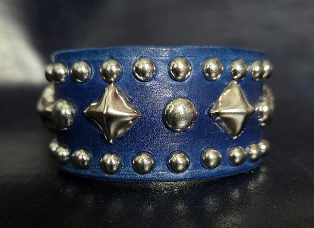 Blue leather wrist cuff.