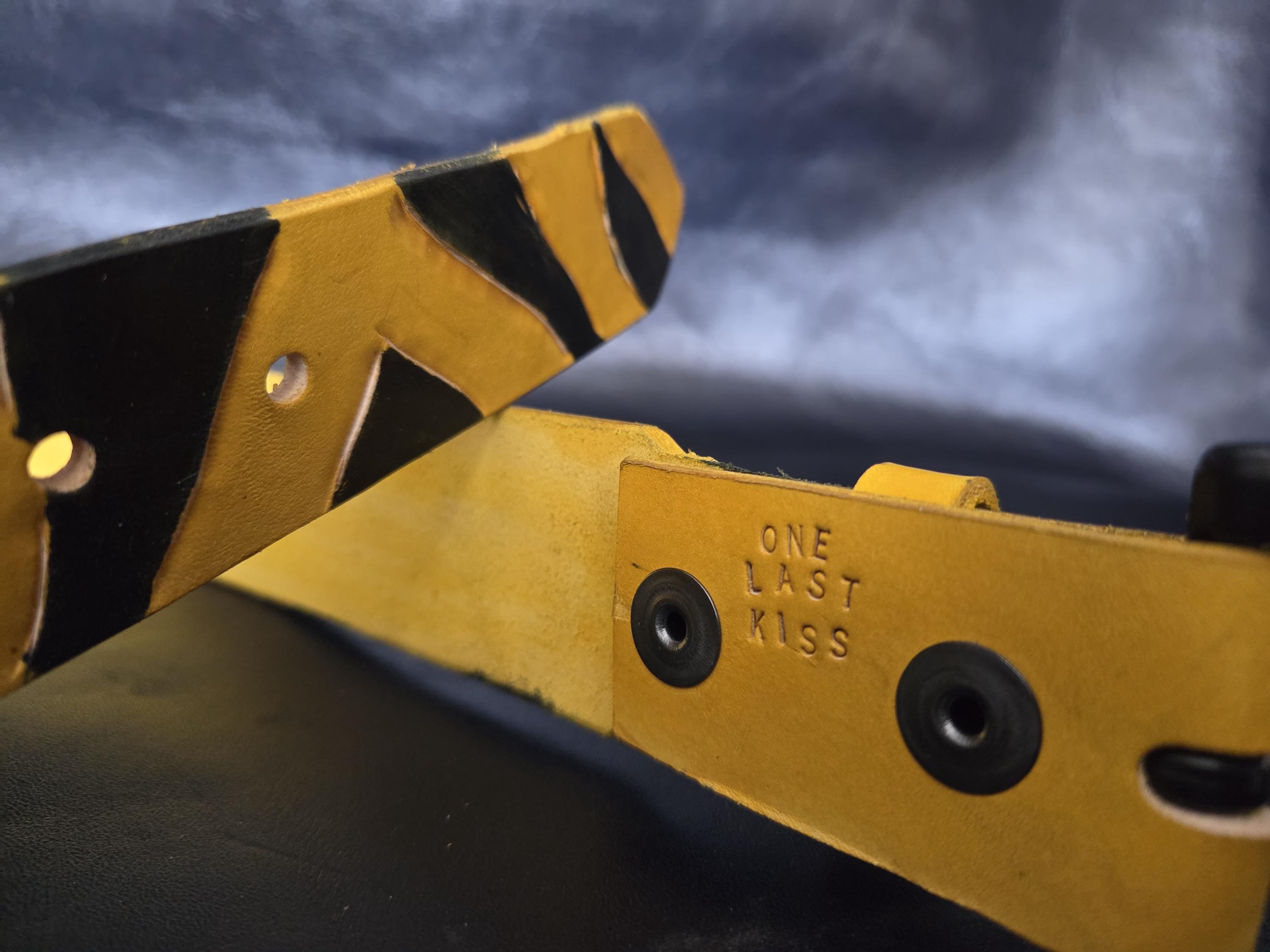 Leather tiger-stripe belt.