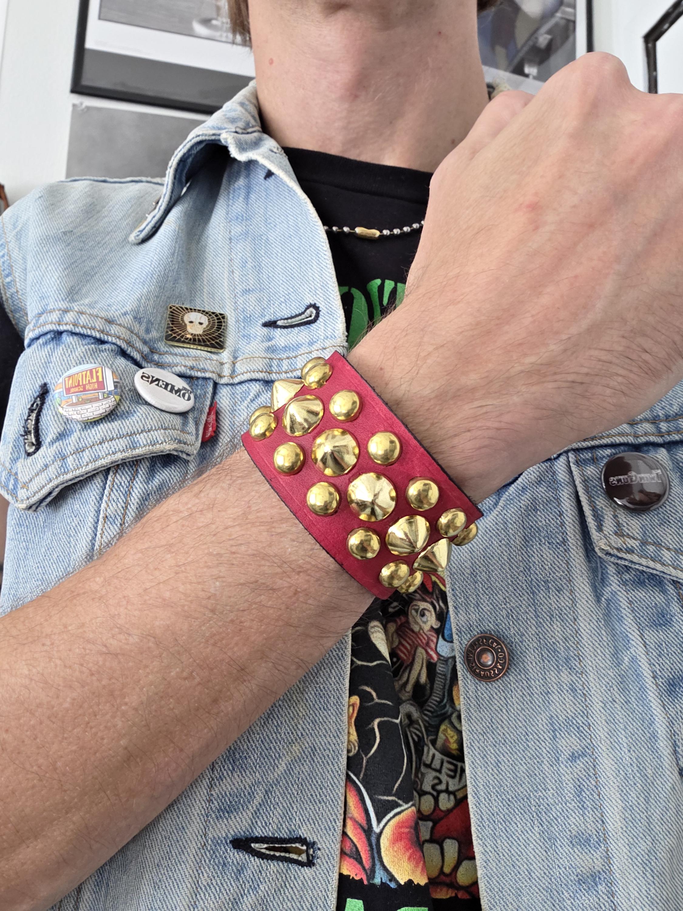 Red Punk studded wrist cuff.