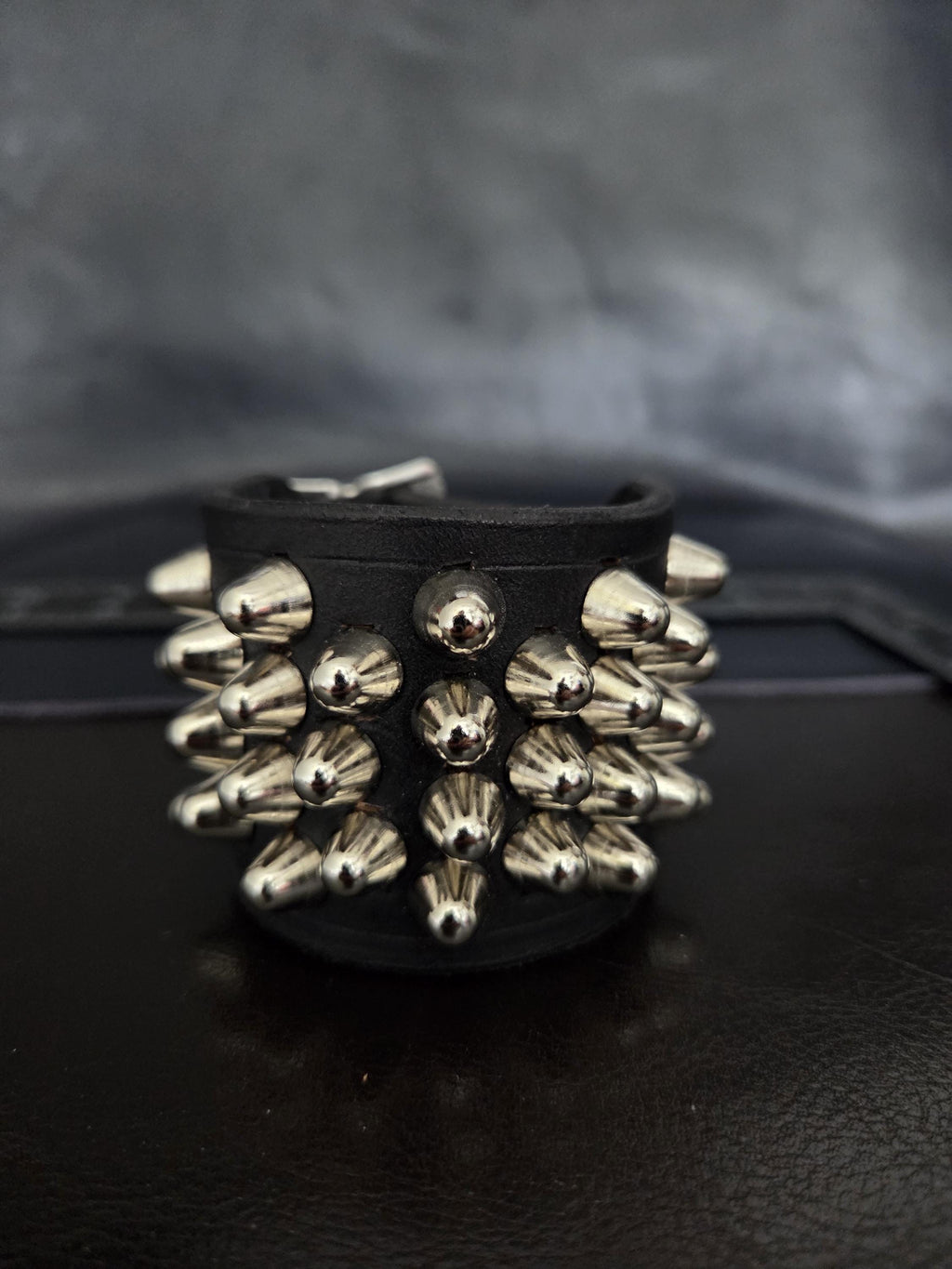Punk leather studded wrist cuff with buckles.