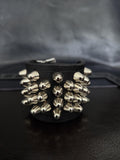 Punk leather studded wrist cuff with buckles.