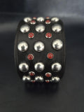 Studded wrist cuff.