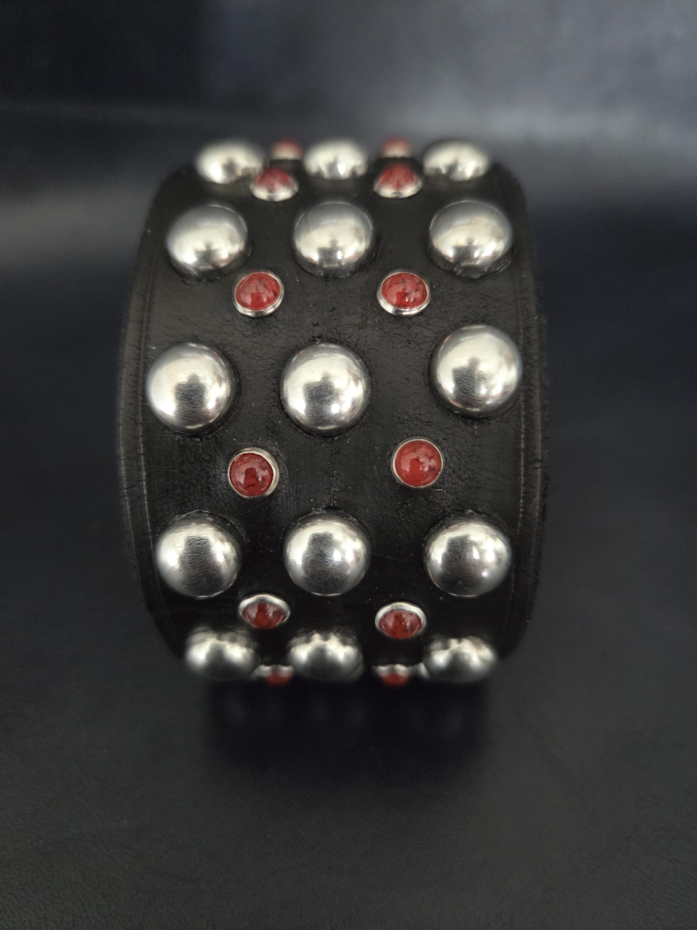 Studded wrist cuff.
