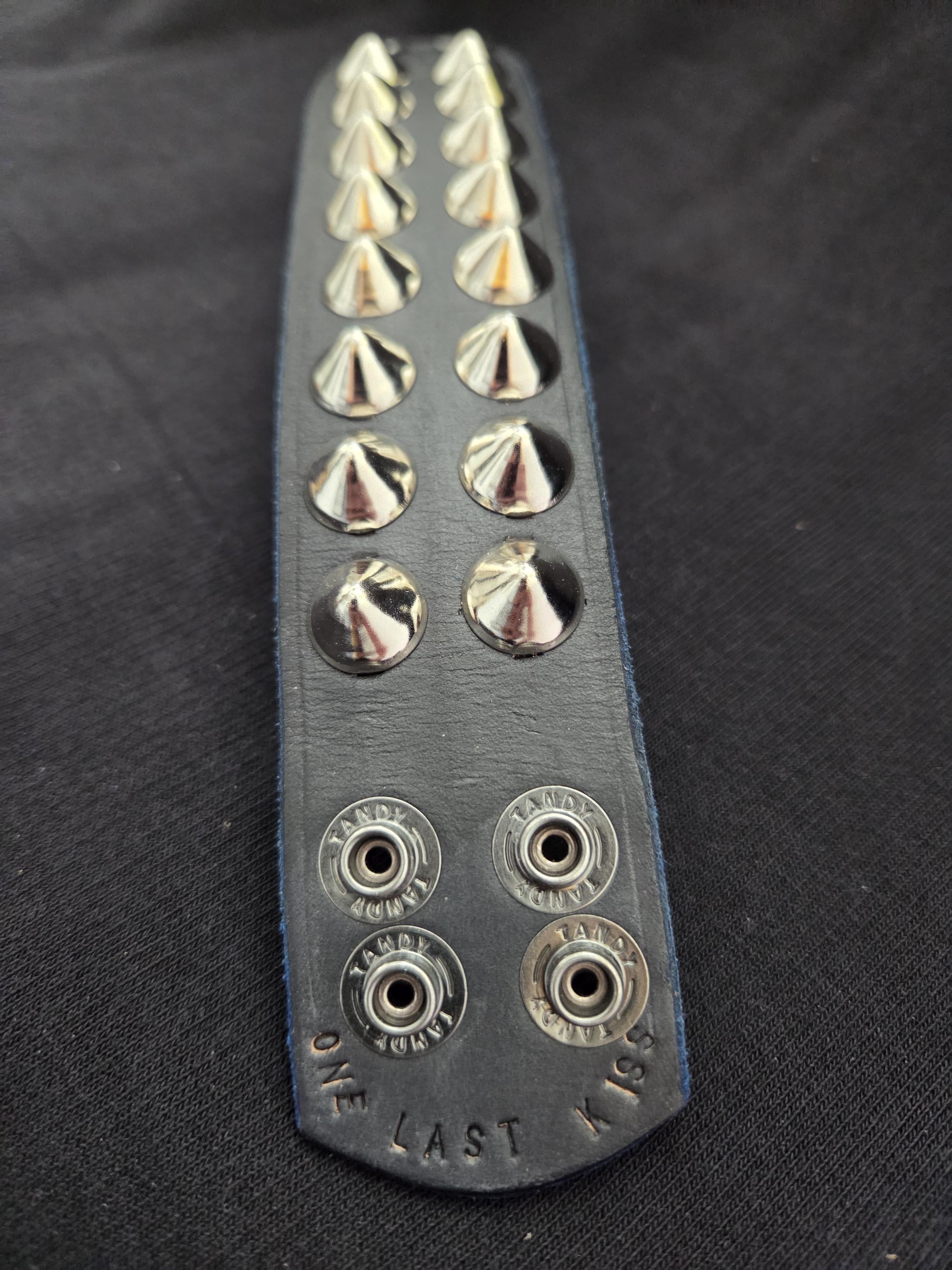 Studded leather punk wrist cuff.
