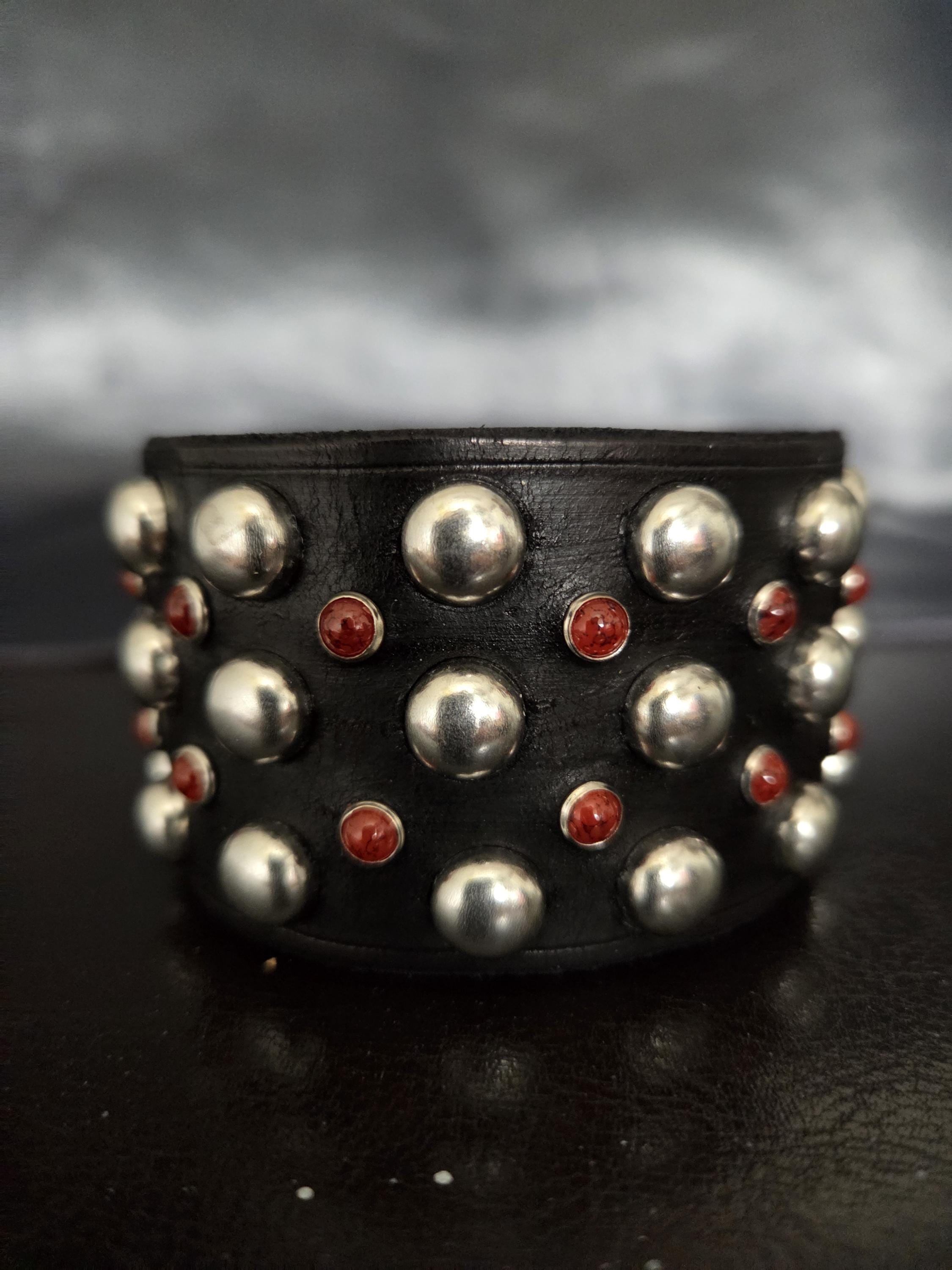 Studded wrist cuff.