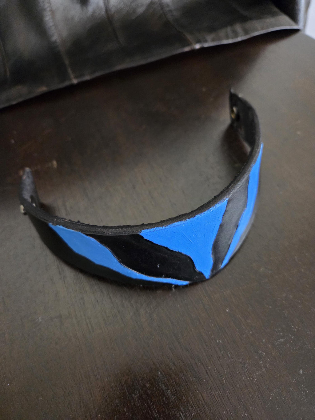 Black n' blue leathet wrist cuff bracelet.