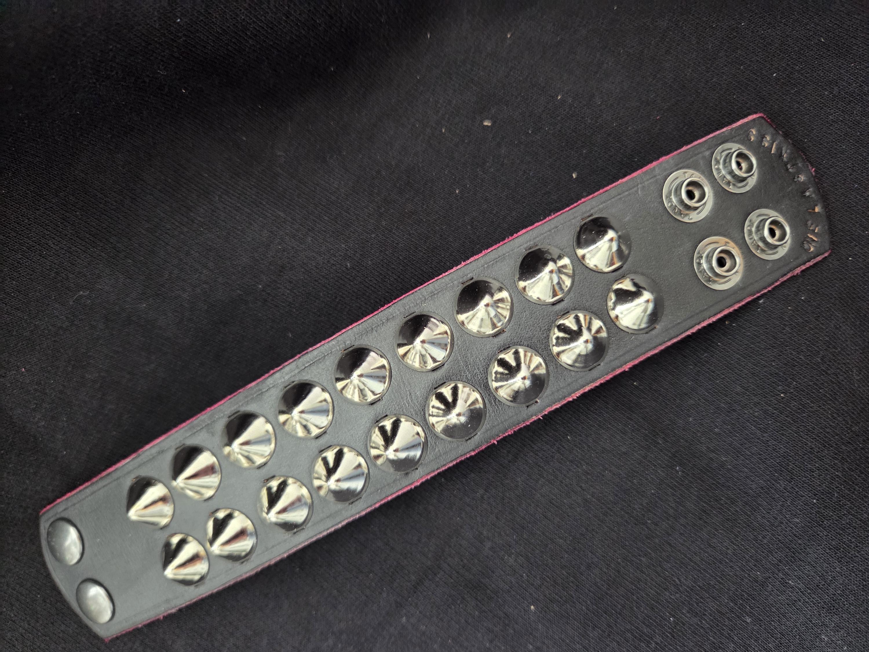 Studded leather punk wrist cuff.